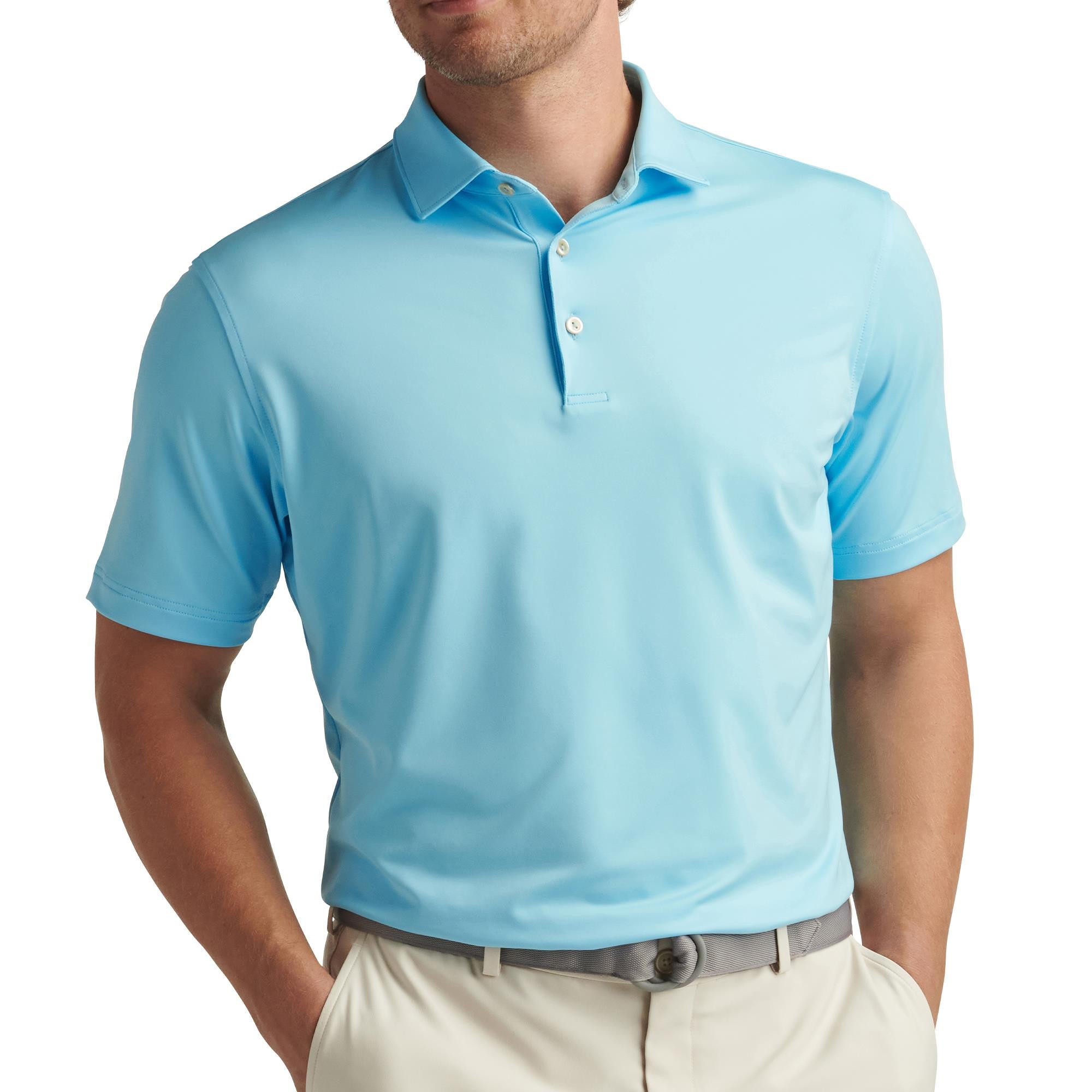 Model front view wearing Peter Millar Solid Performance Polo Shirt in Maya Blue – premium golf polo shirt for men